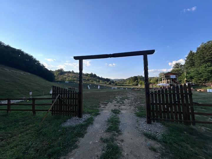 The wooden gate at the entrance to the site